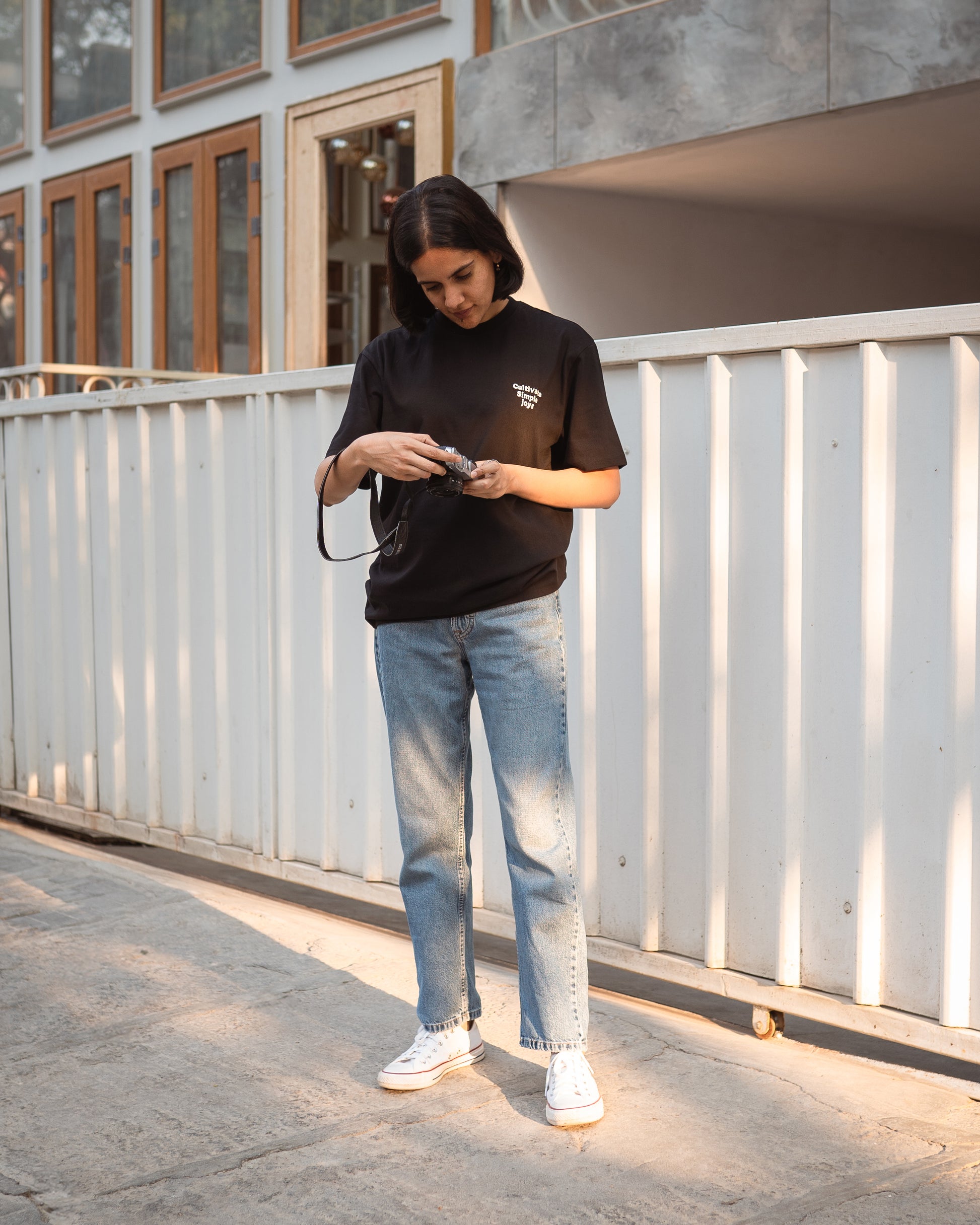 Rust unisex organic cotton tee with subtle chest embroidery, casual conscious styling