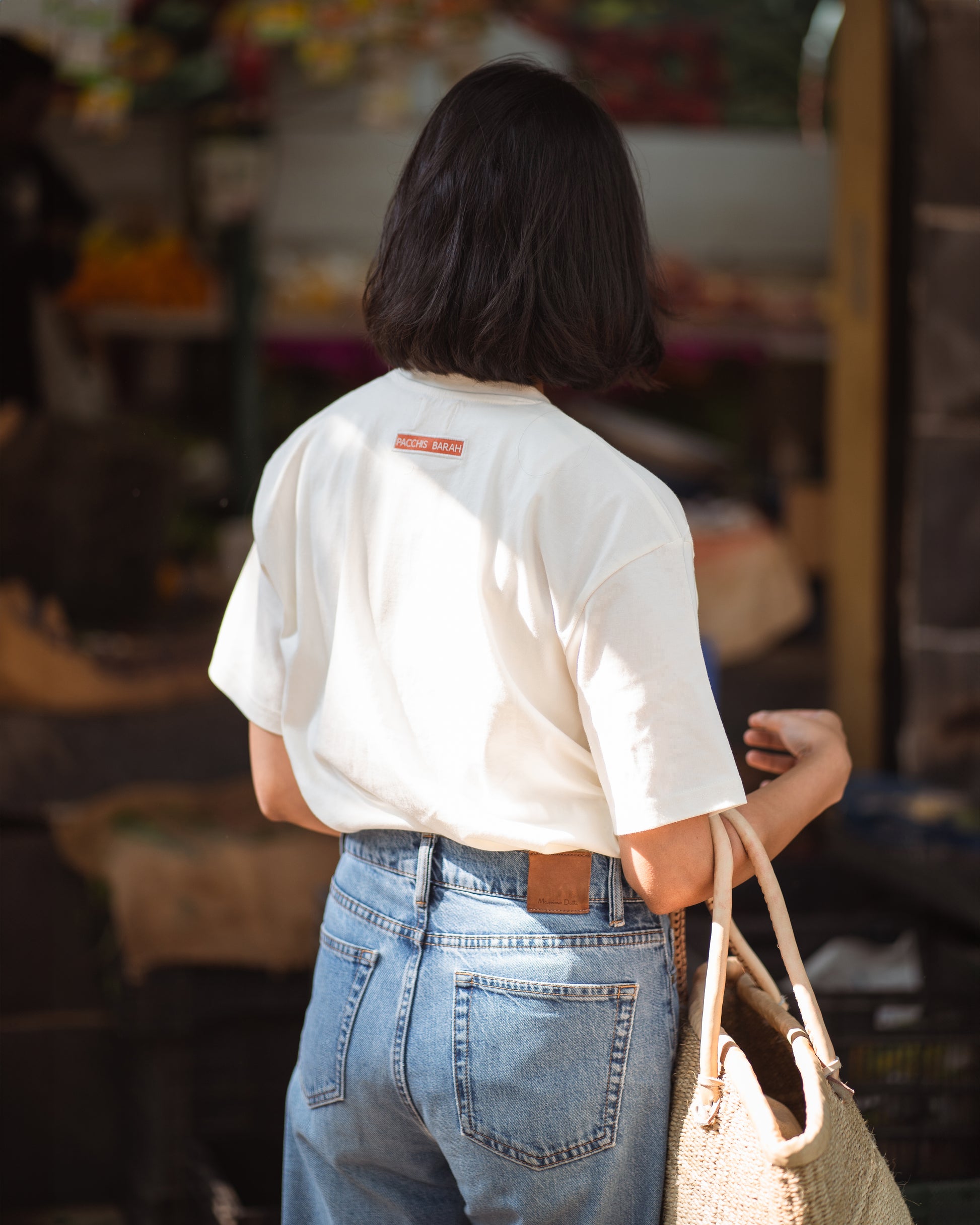 Back view of white t-shirt in relaxed, breathable fit