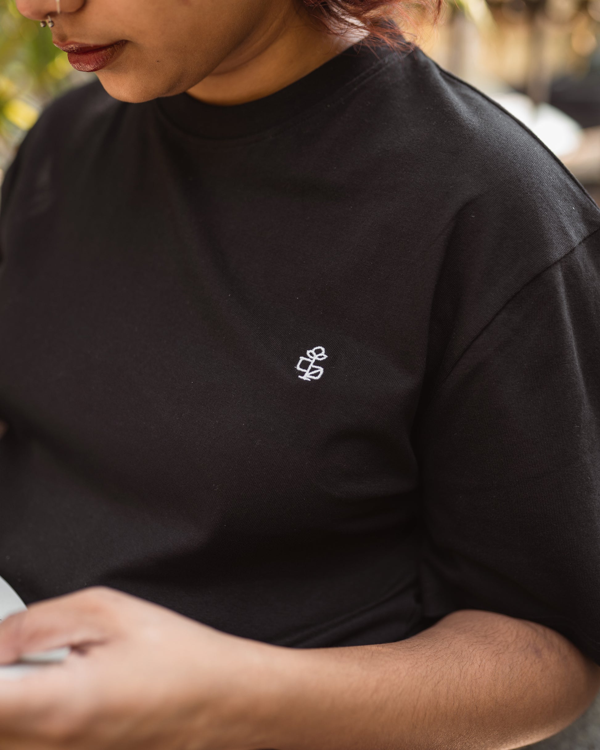 Close-up of black fabric and 2512 embroidery detail