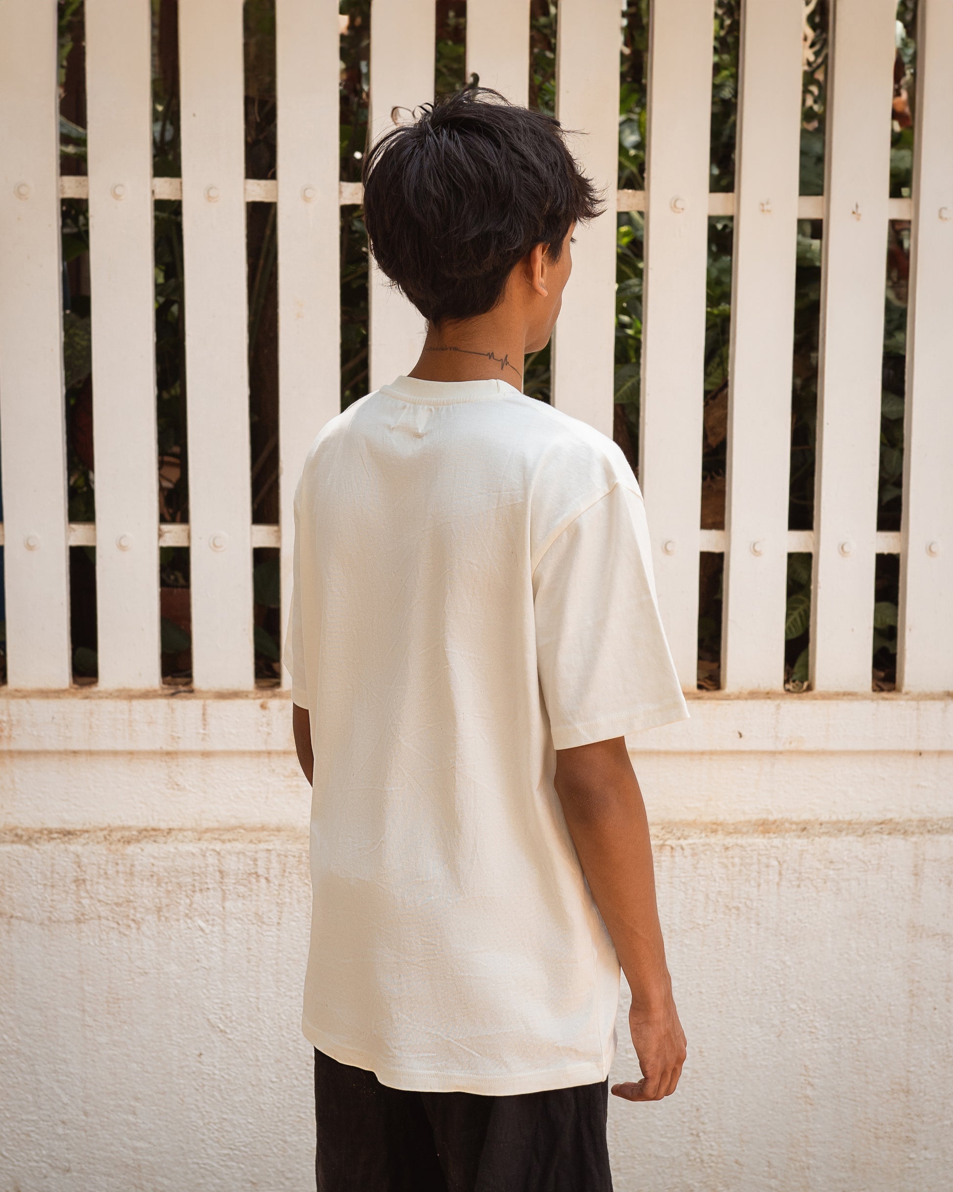 Back view of breathable white organic t-shirt, relaxed fit