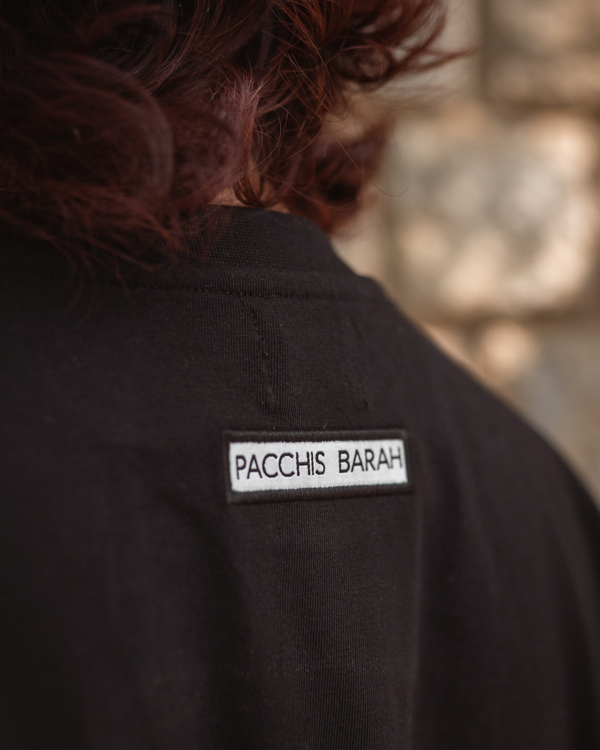 Close-up of black fabric and 2512 logo patch detail